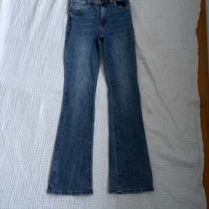 Kut from the Kloth Ana Mid-Rise Fab Ab Flare Jeans